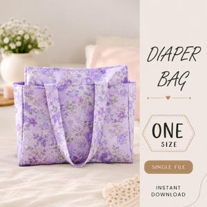 May include: A rectangular tote bag featuring a light purple fabric with a dense floral pattern in darker shades of purple. The bag has two sturdy handles and a structured shape. Text on the right reads DIAPER BAG, ONE SIZE, SINGLE FILE, INSTANT DOWNLOAD.