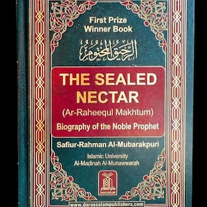 May include: A hardback book titled "THE SEALED NECTAR" with gold lettering and decorative borders. The book is a biography of the Prophet, written by Safiur-Rahman Al-Mubarakpuri and published by Darussalam Publishers. The cover is dark green and red.