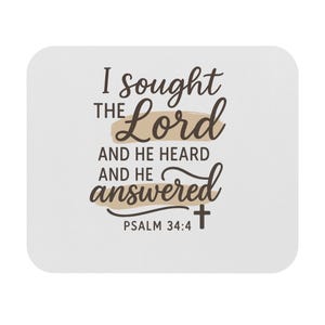 May include: White square coaster with rounded corners. The coaster features the text "I sought the Lord and He heard and He answered" in a mix of script and block fonts. A cross is at the bottom, with "Psalm 34:4" below it.