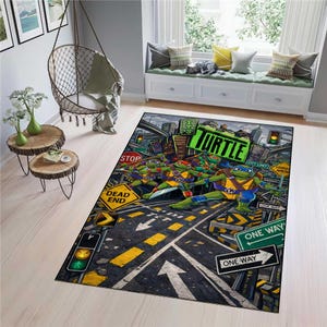 May include: A rectangular area rug featuring a graphic illustration of four anthropomorphic turtles in a city street setting. The design includes street signs, traffic lights, and the text "TURTLE" in large green letters against a dark background.