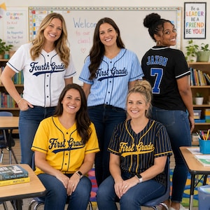 May include: Five baseball-style jerseys in various colors and patterns. One white with blue text, one light blue with white pinstripes and text, one yellow with blue text, one navy with yellow pinstripes and text, and one black with blue text and number 7.