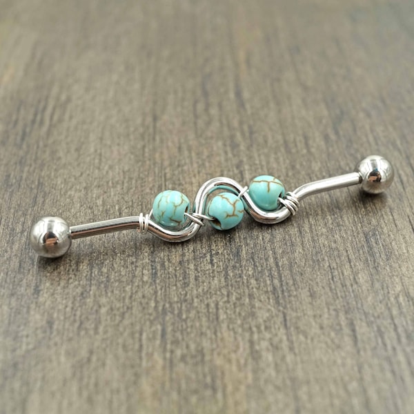 Piercing industriel bleu turquoise pour échafaudage avec haltères