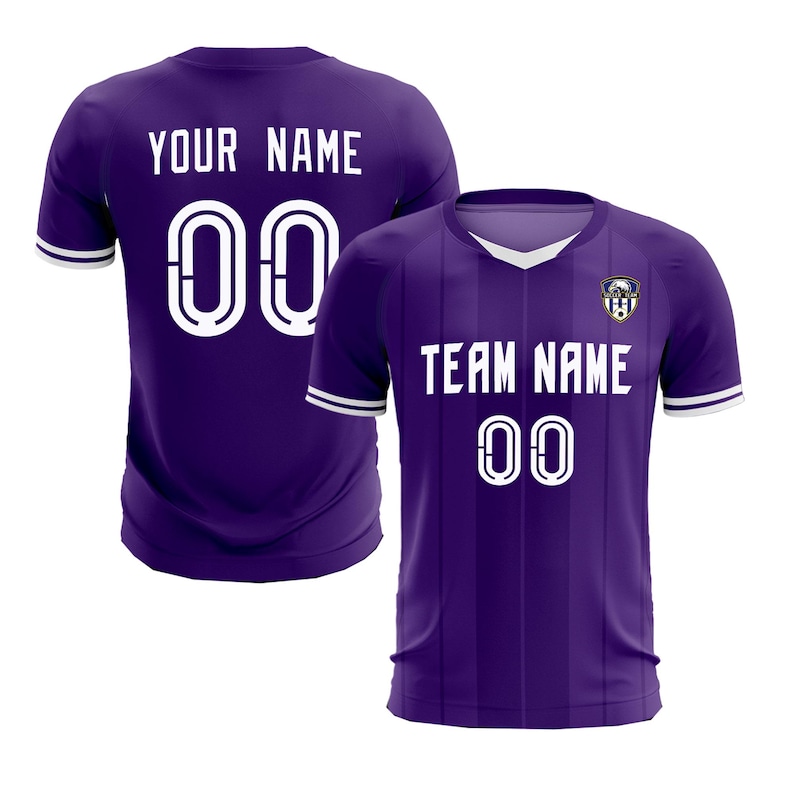 May include: Two purple soccer jerseys. One jersey displays "YOUR NAME" and the number "00" in white. The other jersey shows "TEAM NAME" and the number "00" in white. Both jerseys have white trim.