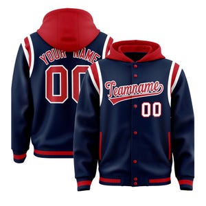 May include: Navy blue hooded varsity jacket with red accents and white stripes. The jacket features a red hood, a button-up front, and the text "Teamname" in script. The number "00" is displayed on the front and back of the jacket.