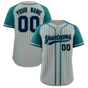May include: Baseball jersey with teal sleeves and accents, featuring vertical stripes. The front displays "Yourteams" and the number "00". The back has "YOUR NAME" and the number "00".