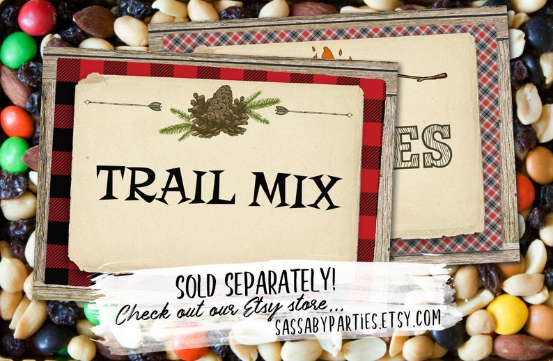 May include: Two printable signs with a rustic woodgrain background and red and black buffalo plaid border. The first sign says "TRAIL MIX" with a pine cone and arrow design. The second sign says "S'mores" with a stick figure roasting a marshmallow over a fire. The text at the bottom of the signs reads "SOLD SEPARATELY! Check out our Etsy store... SASSABYPARTIES.ETSY.COM"