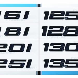 Peut inclure: Plusieurs autocollants noirs avec des chiffres et des lettres, dont "1161", "1181", "1201", "1251", "125d", "128d", "130d", et "135d", sont affichés sur un fond blanc. Les décalcomanies sont en gras, police sans-serif.