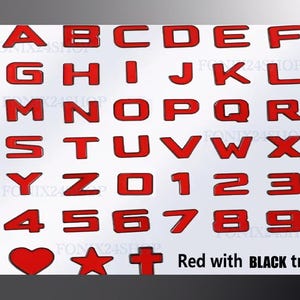 May include: A set of red letters, numbers, and symbols with black trim arranged in rows on a white background. The collection includes the alphabet from A to Z, digits 0 through 9, and three icons: a heart, a star, and a cross. Text reads Red with BLACK trim.