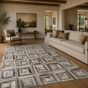 Koeienhuid vloerkleed 5 x 8 ft (152 x 244 cm) met geometrisch 3D-patroon, handgemaakt, ivoorkleurig en zwart.