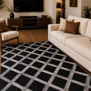 Koeienhuid vloerkleed 5 x 8 ft (152 x 244 cm) met geometrisch 3D-patroon, handgemaakt, ivoorkleurig en zwart.
