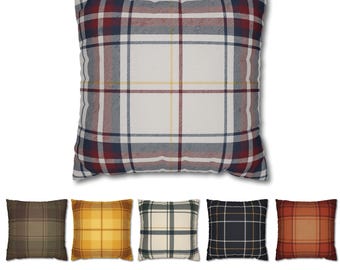 May include: A square cushion featuring a plaid design in red, navy, white, and yellow. Beneath, five more cushions in diverse plaid patterns are shown, including brown, yellow, green, black, and orange.