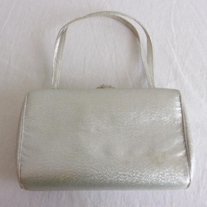 Bolso mini plateado vintage de los años 60 con cartera a juego, estilo disco.