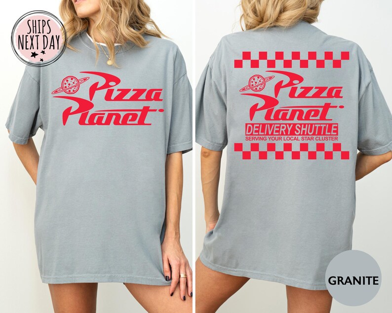 May include: A grey t-shirt with the red "Pizza Planet" logo on the front and back. The back of the shirt also features the text "Delivery Shuttle" and "Serving Your Local Star Cluster".