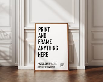 May include: A framed print with the text "PRINT AND FRAME ANYTHING HERE" in bold black letters on a white background. The frame is a warm brown colour. The bottom of the print reads "PHOTOS, CERTIFICATES, DOCUMENTS & MORE".
