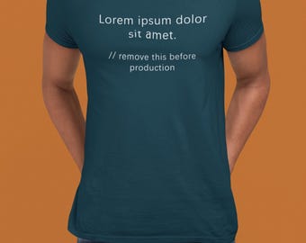 May include: Teal t-shirt with white text that reads "Lorem ipsum dolor sit amet." and "// remove this before production." The shirt is being worn by a person. The background is a solid orange color.