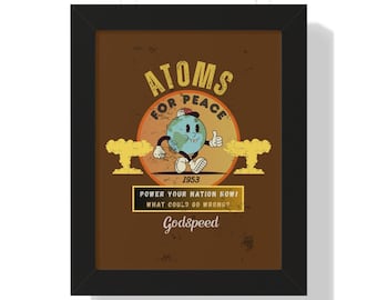 May include: Framed art print with a vintage-style illustration. The artwork features a cartoon globe character with the text "ATOMS FOR PEACE" and "1953." Additional text reads "POWER YOUR NATION NOW! WHAT COULD GO WRONG?" and "Godspeed."