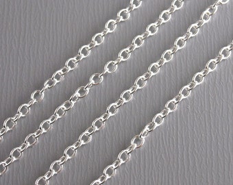 May include: White metal curtain rod bracket with a hook on the end. The bracket is designed to be mounted to a wall or ceiling.