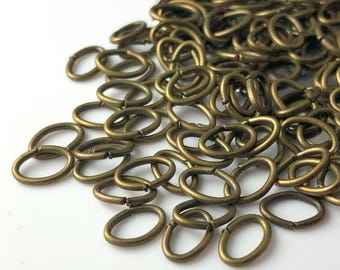 7mm x 5mm, 20 gauge, Oval Jump Rings, Antique Bronze Plated - 50 pieces