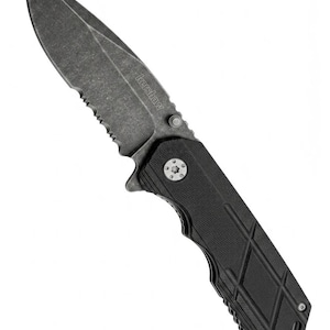 May include: A black and gray folding knife with a serrated edge and a textured handle. The blade is dark gray with the brand name "Kershaw" printed on it. The knife is designed for utility and everyday carry.