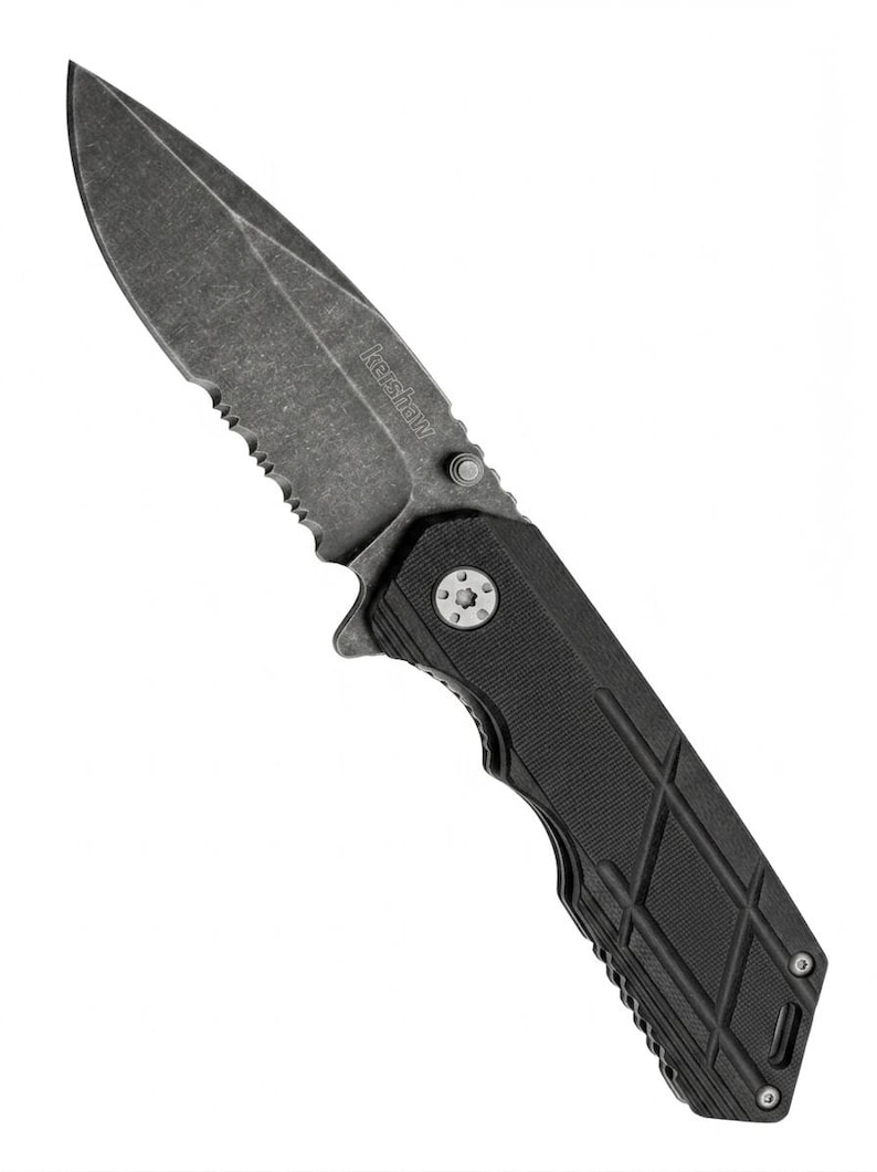 May include: A black and gray folding knife with a serrated edge and a textured handle. The blade is dark gray with the brand name "Kershaw" printed on it. The knife is designed for utility and everyday carry.