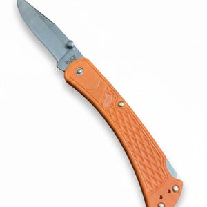 May include: An orange folding knife with a silver blade. The handle has a textured diamond pattern and is marked with the brand "BUCK". The knife is designed for outdoor use and measures approximately 8 inches in length when open.