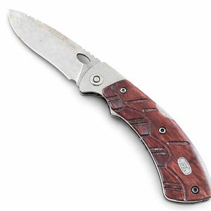 May include: A folding knife with a stainless steel blade and a partially serrated edge. The handle is made of dark reddish-brown wood with a silver metal bolster. The knife is angled on a white background.