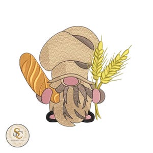May include: An embroidered gnome baker with a long, tan beard, holding a baguette and wheat stalks. The gnome wears a chef's hat and has pink accents on the nose and hands. The design is on a white background.