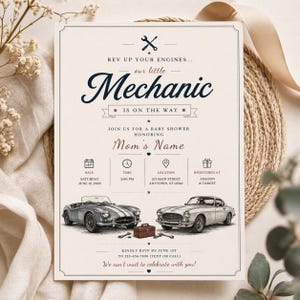 May include: Cream-colored baby shower invitation with a vintage car theme. The text reads "Rev up your engines... our little Mechanic is on the way." Includes date, time, location, and RSVP information. Features illustrations of classic cars.