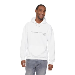 May include: A white hoodie with a front pocket and a drawstring. The sweatshirt displays the quote "Ain't no such thing as halfway crooks" and the brand name "MOBB DEEP" in black script.
