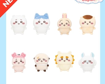 May include: A collection of eight small plush toys featuring various cartoon characters with round faces, expressive eyes, and blushing cheeks. The characters include white, blue, tan, and pink figures with distinct ears, hair, and accessories.