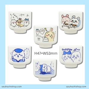 May include: A set of six white ceramic cups, each decorated with a different cartoon illustration in black, blue, pink, and yellow. The cups measure approximately 47mm high and 53mm wide. They have a rounded base and a slightly flared rim.