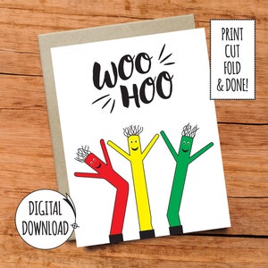 May include: Printable greeting card with the text "Woo Hoo" and three cartoon inflatable tube men in red, yellow, and green. The card is on a wood background.
