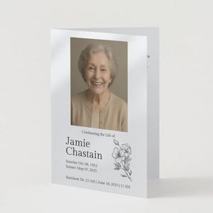 May include: A white memorial card with a photograph of a smiling woman. The card includes the text "Celebrating the Life of Jamie Chastain" along with dates and a floral illustration.