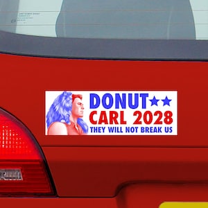 May include: A rectangular bumper sticker with a white background featuring a profile illustration of a person with long blue hair next to the text DONUT CARL 2028 and the phrase THEY WILL NOT BREAK US in blue and red lettering with two blue stars.