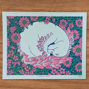 May include: A print featuring a white cat curled up in a circle of pink and green flowers. The cat is sleeping, with its head tucked in. The background is a blue and green floral pattern. The print is titled "Sleeping Mango".