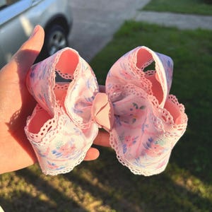 May include: A set of three ceramic mugs with a speckled, matte finish. The mugs are in shades of cream, light gray, and dark gray. Each mug has a simple, minimalist design and a rounded handle.