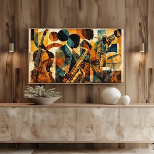 May include: A framed abstract art print featuring a jazz band. The artwork depicts musicians playing instruments, including a saxophone, trumpet, and cello, with a geometric background in shades of orange, blue, and brown.
