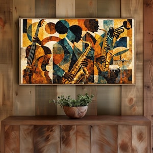May include: Abstract art print featuring a jazz band. The artwork depicts musicians playing a cello, saxophone, trumpet, and drums. The color palette includes shades of brown, orange, yellow, and blue. The print is framed in a wooden frame.