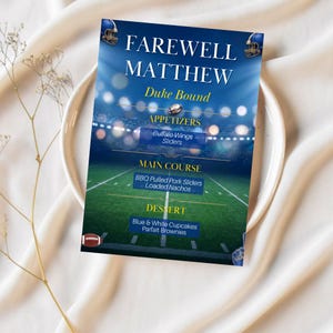 May include: A rectangular menu card featuring a football stadium background with the text FAREWELL MATTHEW, Duke Bound, APPETIZERS, Buffalo Wings, Sliders, MAIN COURSE, BBQ Pulled Pork Sliders, Loaded Nachos, DESSERT, Blue & White Cupcakes, Parfait Brownies.