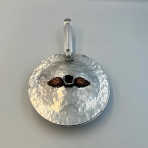 May include: A white ceramic mug with a black handle and the text "But First, Coffee" in a black, bold font. The mug is on a white surface. The mug is 4 inches tall.