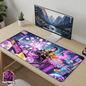 May include: A rectangular desk mat with a comic book style illustration. The design features a superhero character, neon signs, and the word "SPARK". The colour scheme is vibrant, with pink, blue, and yellow accents. The mat has the "PhantomDesk" logo.