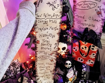 May include: A white scroll with black text lists Christmas stocking stuffers, including "Holly Jolly Holly?", "New Fallen Snow", "Chimney Bricks", "Fireplace Mantle", "(x) Stockings", "Total Stocking Stuffers", "Good Cheer + Chestnuts", "Open Fire", "Mistletoe", "Sleigh Bells", "Dec 12", "Candy Claws", "Christmas?", "30 x 12 = Sugar Plum Visions", "Egg Nog", "Good Cheer + Chestnuts (Open Fire)".