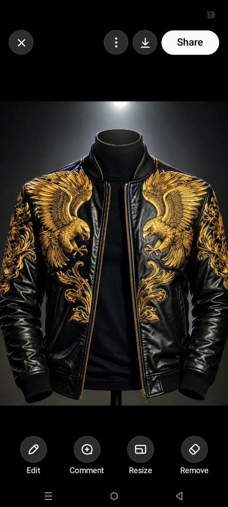May include: A black leather bomber jacket featuring intricate gold embroidery of eagles on the chest and shoulders. The jacket has a ribbed collar, cuffs, and hem, with a central gold zipper closure worn over a black mock neck shirt.