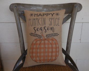 May include: A brown burlap pillow with the text "Happy Pumpkin Spice Season" and a checkered pumpkin graphic.