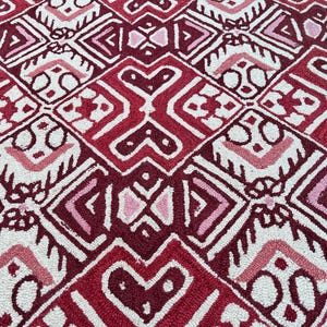 Red black wool carpet with cream geometric details and statement design
