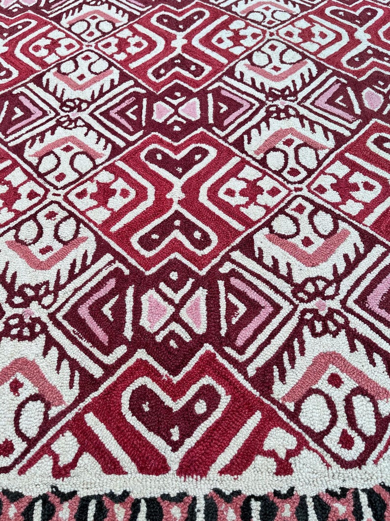 Red black wool carpet with cream geometric details and statement design