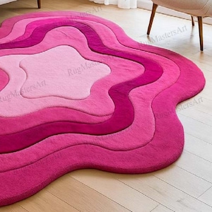 Modern pink hand tufted area rug with abstract ripple pattern, irregular funky shape carpet, soft layered contour rug for aesthetic bedroom, cozy living room and trendy girly decor.