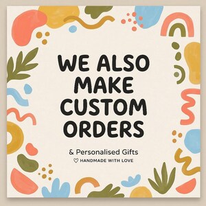May include: Square graphic with the text "WE ALSO MAKE CUSTOM ORDERS" in bold black letters. The text is surrounded by colorful abstract shapes in orange, blue, green, and yellow. Below the text is "& Personalised Gifts" and "HANDMADE WITH LOVE".