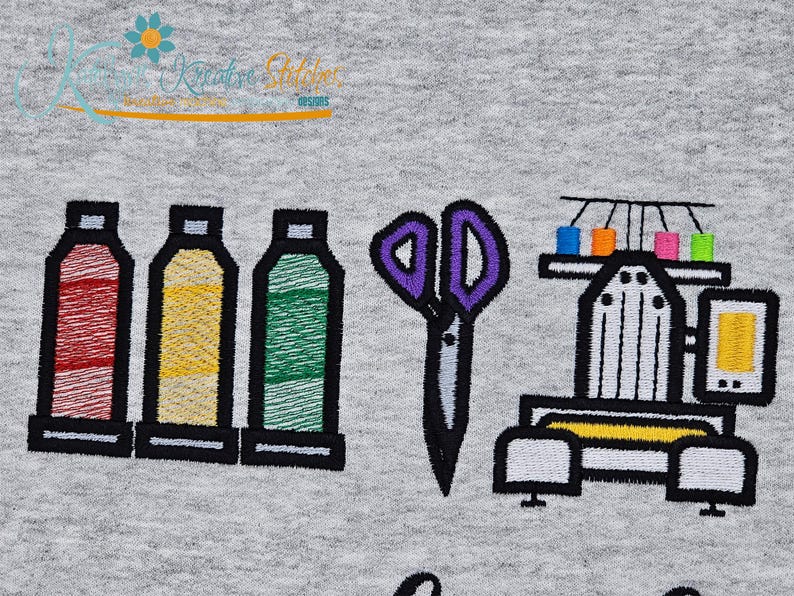 May include: Embroidered design featuring spools of thread in red, yellow, and green, purple scissors, and a sewing machine. The design is on a gray background. The text "Kreative Stitches" is at the top.