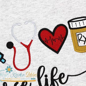 May include: Embroidered design featuring a stethoscope, a heart with a heartbeat line, a pill bottle with an RX symbol, and the text "It's like".